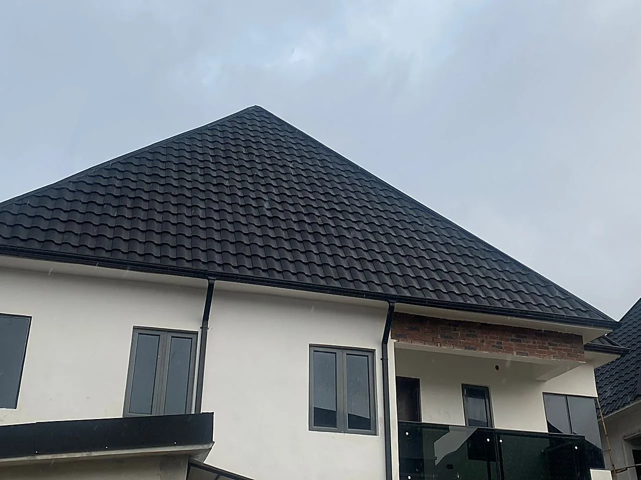 Completed two-storey duplex, dark tile roof