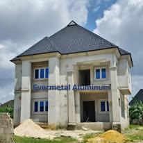 Completed Evermetal Stone-Coated Classic roof installation on a two-storey residential building under construction